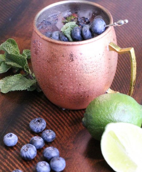 Blueberry Mule vodka drink with mint, lime, and Wish Farms blueberries