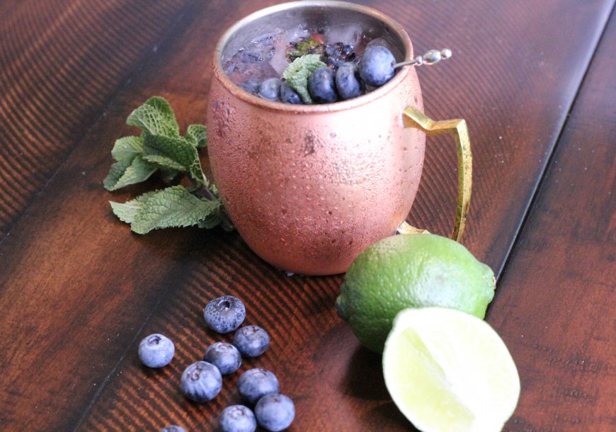 Blueberry Mule vodka drink with mint, lime, and Wish Farms blueberries